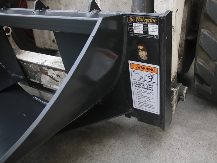 skid steer tree digger side view